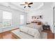 Bright main bedroom with a tray ceiling and well decorated furnishings at 4874 Seldon Se Way, Smyrna, GA 30080