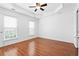 Bright main bedroom with a tray ceiling and ample natural light at 4874 Seldon Se Way, Smyrna, GA 30080
