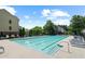 Large community swimming pool surrounded by lounge chairs and lush landscaping, perfect for relaxing at 4874 Seldon Se Way, Smyrna, GA 30080