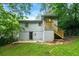 Backyard of house with well-maintained grassy area and stairs at 1649 Nw Ezra Church Nw Dr, Atlanta, GA 30314