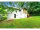 Side view of backyard and house with grassy area and stairs at 1649 Nw Ezra Church Nw Dr, Atlanta, GA 30314