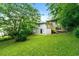 View of the house with stairs and lush green backyard at 1649 Nw Ezra Church Nw Dr, Atlanta, GA 30314