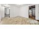 Partially finished basement with door to utility room with adjacent stairway at 1649 Nw Ezra Church Nw Dr, Atlanta, GA 30314