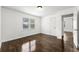 This bedroom boasts original hardwood floors and large windows with natural light at 1649 Nw Ezra Church Nw Dr, Atlanta, GA 30314
