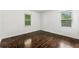 Bright bedroom with hardwood floors and natural light from two windows at 1649 Nw Ezra Church Nw Dr, Atlanta, GA 30314