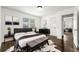 Bright bedroom with modern furnishings, hardwood floors and a calming color palette creating a serene space at 1649 Nw Ezra Church Nw Dr, Atlanta, GA 30314