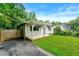 Beautiful home with a cozy porch, a lush green lawn, and a charming fence adding to the curb appeal at 1649 Nw Ezra Church Nw Dr, Atlanta, GA 30314