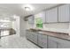 Bright kitchen with new counters, ample cabinets and adjacent open concept living area at 1649 Nw Ezra Church Nw Dr, Atlanta, GA 30314