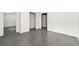 Basement rooms with painted concrete flooring and several door ways at 1649 Nw Ezra Church Nw Dr, Atlanta, GA 30314