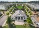Aerial view of 'Harlow Hall' clubhouse set amongst the community homes and green spaces at 20057 Windalier Way, Roswell, GA 30076