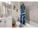 Well-lit bathroom with vanity, sink and tub/shower combo at 20057 Windalier Way, Roswell, GA 30076