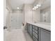 Bathroom featuring a glass shower, vanity with a sink, and large mirror at 20057 Windalier Way, Roswell, GA 30076