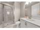 Bright bathroom featuring a glass shower, white vanity, and modern fixtures at 20057 Windalier Way, Roswell, GA 30076