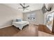 Bedroom with ceiling fan, hardwood floors, and a TV at 20057 Windalier Way, Roswell, GA 30076