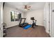 Bright exercise room with a ceiling fan, a treadmill, and stationary bike at 20057 Windalier Way, Roswell, GA 30076