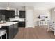 Open-concept kitchen with stylish island, stainless hood, and adjacent dining area at 20057 Windalier Way, Roswell, GA 30076