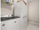 Laundry room with stacked washer and dryer units at 20057 Windalier Way, Roswell, GA 30076