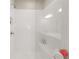 Luxurious walk-in shower featuring tiled walls, a built in bench and shelving at 20057 Windalier Way, Roswell, GA 30076