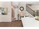 Beautiful staircase with dark wood railing and white risers, leading to the upper level of the home at 20057 Windalier Way, Roswell, GA 30076