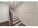 Elegant staircase featuring wood treads and white risers, leading to upper levels at 20057 Windalier Way, Roswell, GA 30076