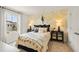 Cozy bedroom with a window view, decorative yellow accents and modern stylish furniture at 2655 Mourning Dove Dr (Lot 50), Grayson, GA 30017
