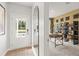 Inviting foyer with wood-look floors, a front door with glass, and a view into the home office at 2655 Mourning Dove Dr (Lot 50), Grayson, GA 30017