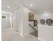 Hallway with neutral colored carpet and walls and decorative artwork at 2655 Mourning Dove Dr (Lot 50), Grayson, GA 30017