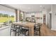 Eat-in kitchen featuring a large dining table, stainless steel appliances, and sliding glass door to the patio at 2655 Mourning Dove Dr (Lot 50), Grayson, GA 30017
