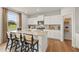 Modern kitchen with granite countertops, white cabinetry, a center island with seating, and a walk-in pantry at 2655 Mourning Dove Dr (Lot 50), Grayson, GA 30017