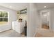 Spacious laundry room equipped with modern appliances and ample natural light through a window at 2655 Mourning Dove Dr (Lot 50), Grayson, GA 30017