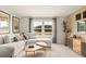 Inviting living room featuring a comfortable sectional sofa, stylish decor, and a large window view at 2655 Mourning Dove Dr (Lot 50), Grayson, GA 30017