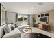 Inviting living room featuring a comfortable sectional sofa, modern coffee tables, and decorative accents at 2655 Mourning Dove Dr (Lot 50), Grayson, GA 30017