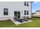 Cozy patio with modern outdoor seating, perfect for relaxing and enjoying the backyard view at 2655 Mourning Dove Dr (Lot 50), Grayson, GA 30017
