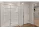 Bathroom with a shower including tiled walls and floors and clear glass doors at 2655 Mourning Dove Dr (Lot 50), Grayson, GA 30017