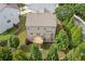 This aerial view highlights the property's backyard, landscaping, and the home's overall layout at 432 Providence Walk St, Canton, GA 30114