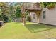 The backyard is spacious with mature landscaping and a view of the deck support structure at 432 Providence Walk St, Canton, GA 30114