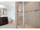 Modern bathroom featuring a glass-enclosed shower with tiled walls and a soaking tub at 432 Providence Walk St, Canton, GA 30114
