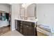 Bathroom with double vanity, storage, and walk-in closet at 432 Providence Walk St, Canton, GA 30114