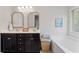 Stylish bathroom featuring double vanity, soaking tub, and elegant decor at 432 Providence Walk St, Canton, GA 30114