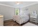 Charming bedroom with soft lighting, a white iron bed frame, and stylish decor at 432 Providence Walk St, Canton, GA 30114