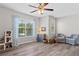 Spacious bedroom with large windows, ceiling fan, and stylish decor at 432 Providence Walk St, Canton, GA 30114