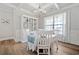 Bright dining room with white furniture, hardwood floors, and a decorative chandelier at 432 Providence Walk St, Canton, GA 30114