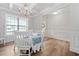 Charming dining room features a coffered ceiling, a chandelier, and an abundance of natural light at 432 Providence Walk St, Canton, GA 30114