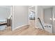 Hallway view of the home's neutral paint, flooring, and bedrooms at 432 Providence Walk St, Canton, GA 30114