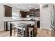 Updated kitchen with dark cabinets, stainless steel appliances, and an island with barstool seating at 432 Providence Walk St, Canton, GA 30114