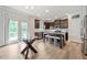 Open kitchen featuring stainless steel appliances, dark wood cabinets, granite countertops, and an island with seating at 432 Providence Walk St, Canton, GA 30114