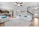 Bright living room features hardwood floors, a modern ceiling fan, and comfortable seating at 432 Providence Walk St, Canton, GA 30114