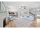 Cozy living room features hardwood floors, a modern ceiling fan, and a comfortable seating arrangement at 432 Providence Walk St, Canton, GA 30114