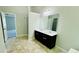 Bathroom featuring a glass shower, double vanity, and ensuite entrance at 4417 Belcamp Rd, Fairburn, GA 30213