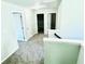 Hallway featuring neutral walls, plush carpet, and white doors at 4417 Belcamp Rd, Fairburn, GA 30213